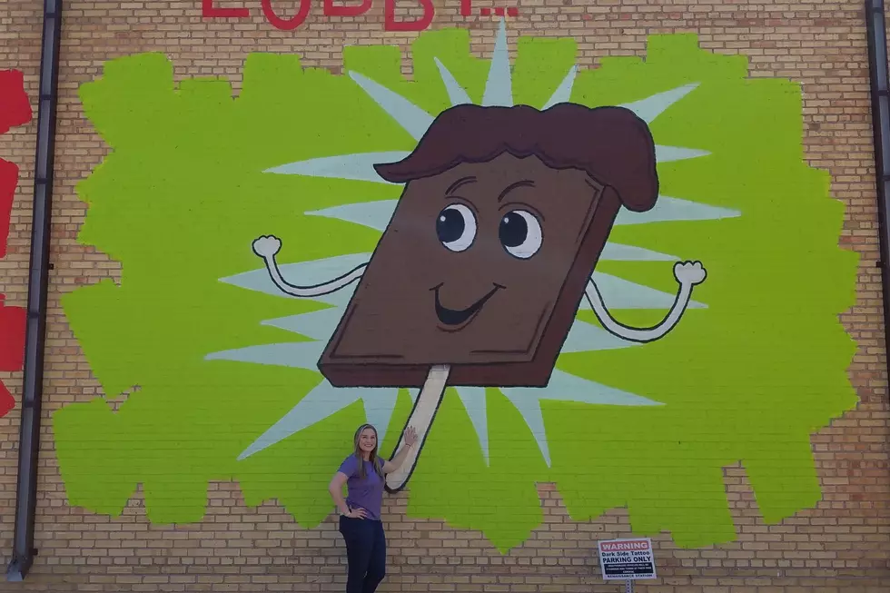 2022 Leadership Williston participant Devyn Cox by her favorite mural panel "Mr. Fudgesicle" / Robin Travers