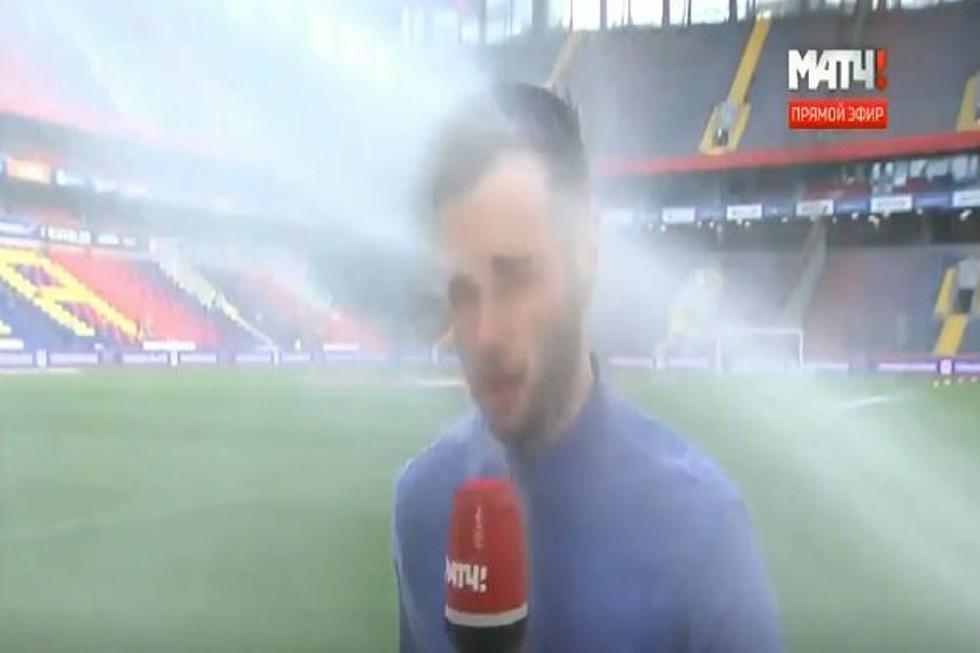 Sports Reporter Gets Nailed by Sprinkler but Keeps Going! [VIDEO]