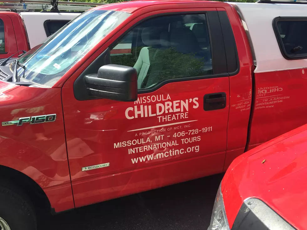 Why Does The Missoula Children’s Theater Have An Entire Fleet Of Red Trucks In Their Parking Lot Right Now?