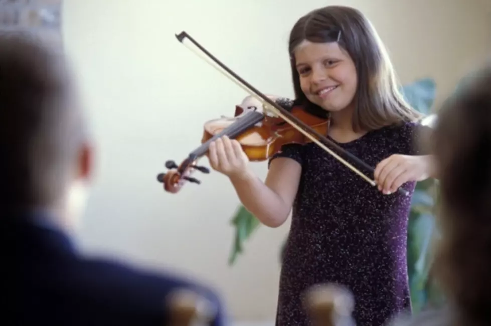 Young Girl Becomes Violin Street Performer