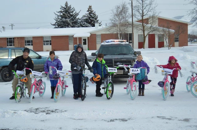Missoula Deputies Distribute 100 Donated Bikes To Kids