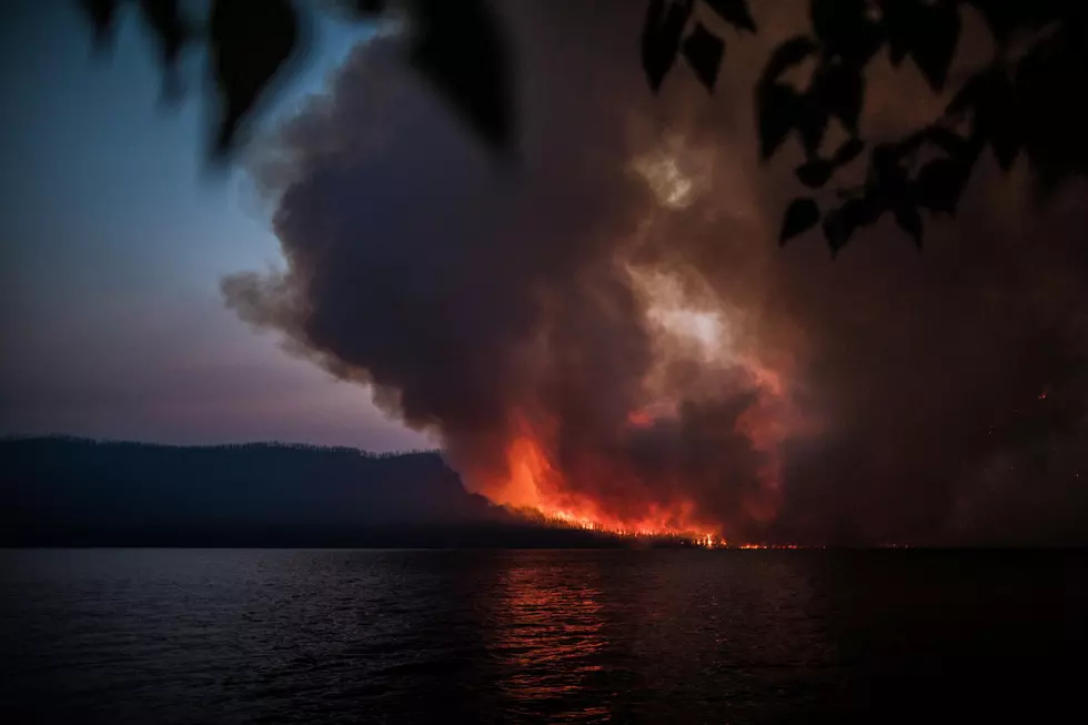 Helicopters Scooping Water from Lake McDonald to Fight Park Fire