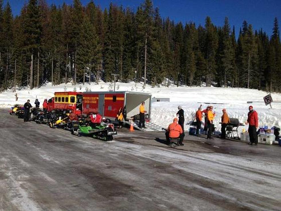 Search and Rescue Assist in Bringing Snowmobiler to Safety