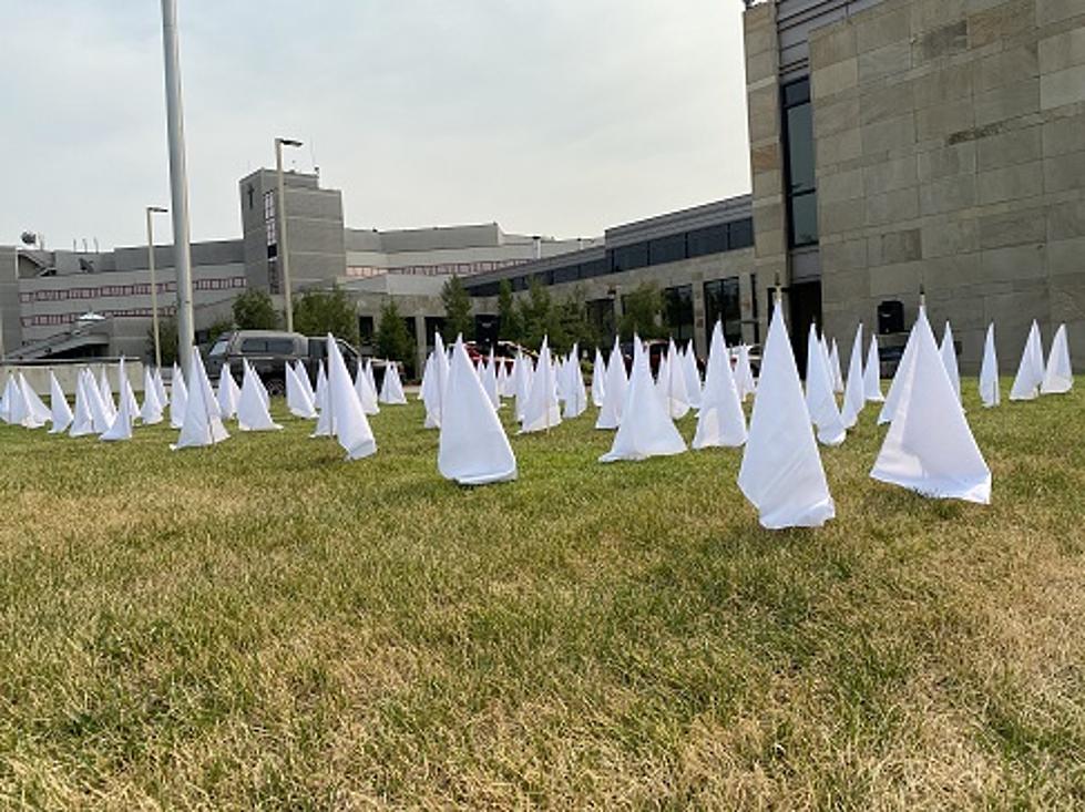 82 White Flags on the Lawn at St. Patrick’s Honor COVID Deaths