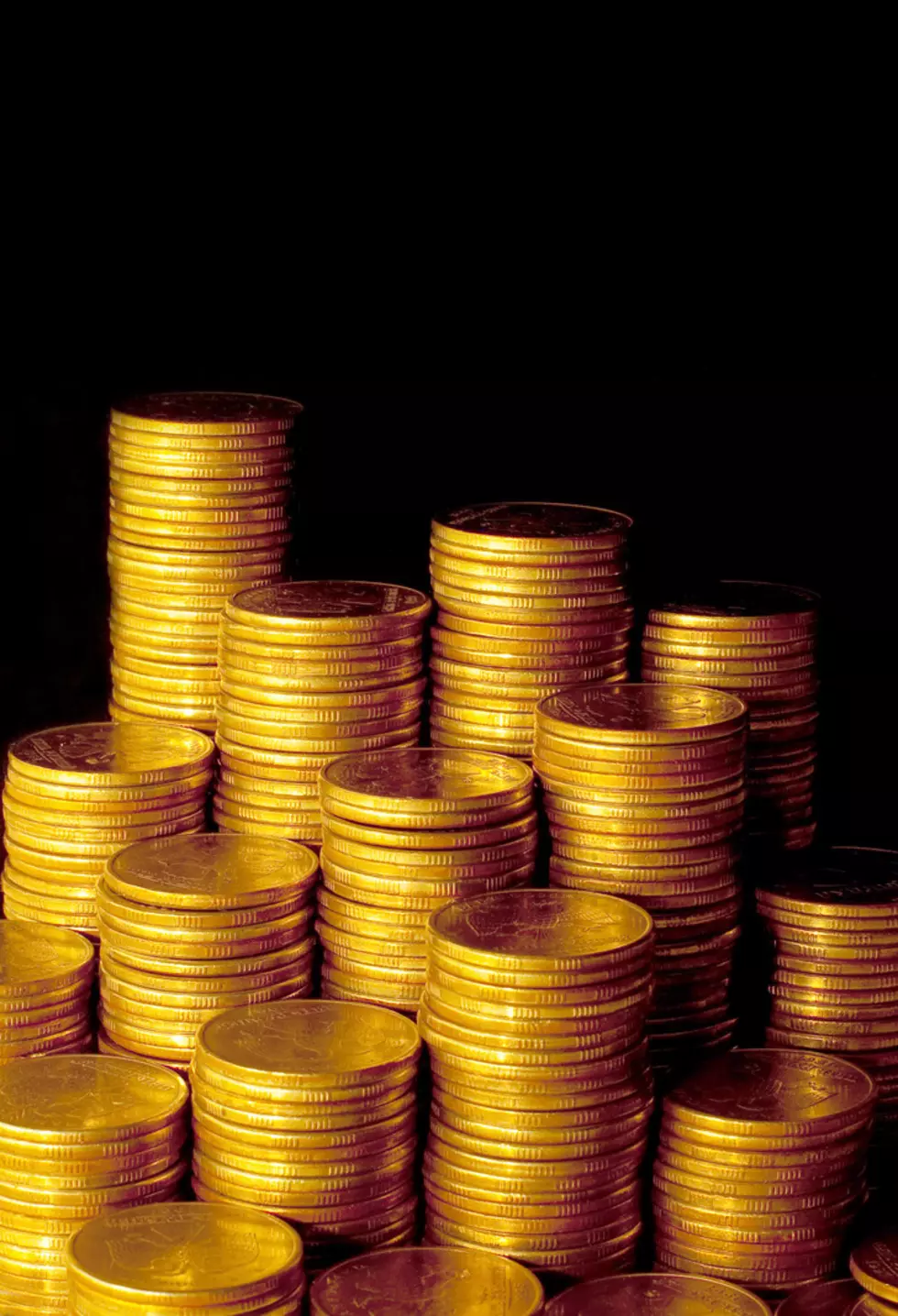 Golden coins isolated on black background