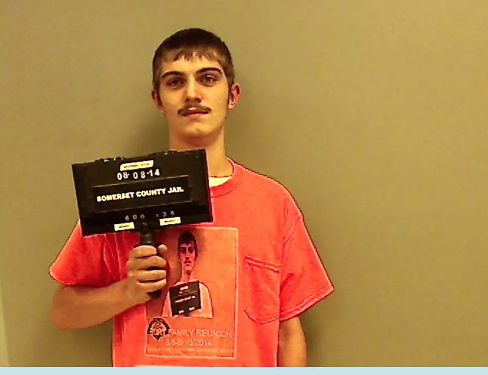 A Guy Takes His Mugshot Wearing a T-Shirt With His Old Mugshot On It