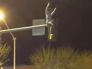 WATCH - Rowdy Cowboy Rides Street Light in Miles City