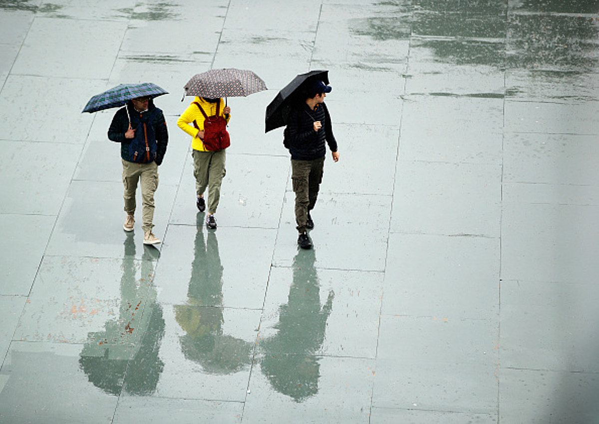 Raining meaning. Walk under the Umbrella. Walking with Umbrella.