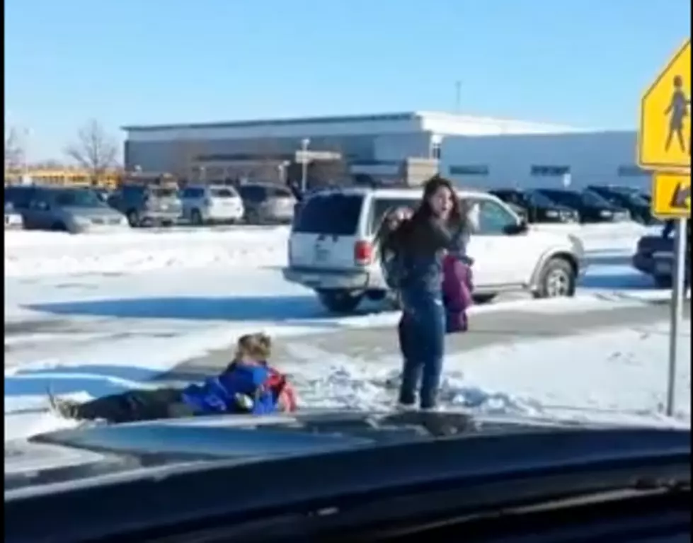 Dad Laughs at Children Slipping on Ice [VIDEO]