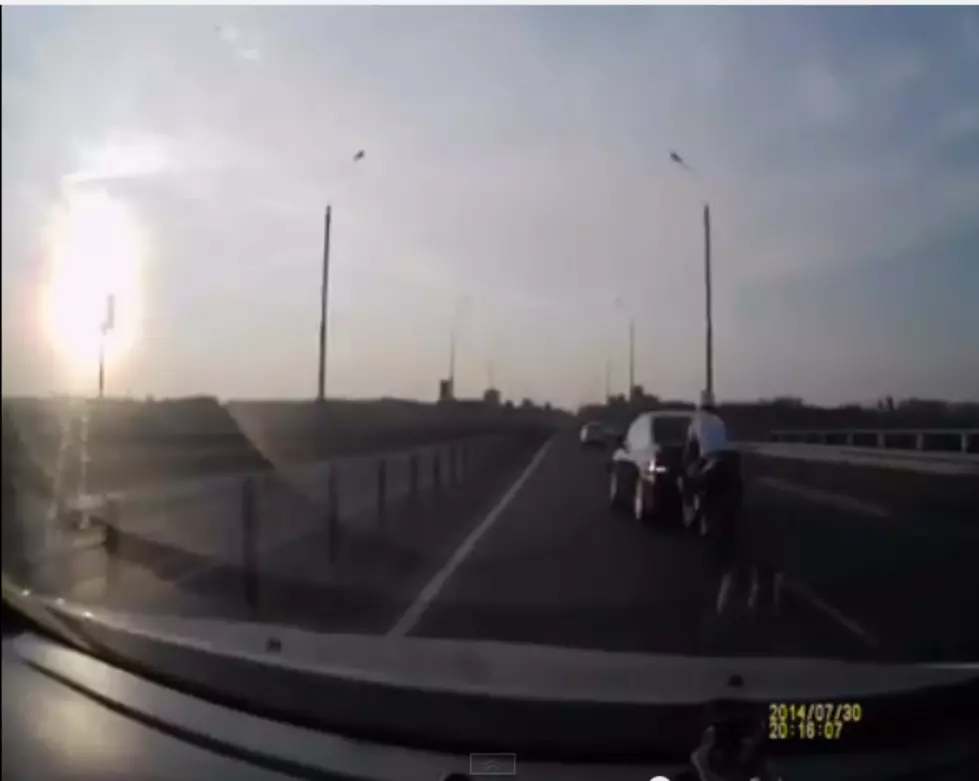A Guy on a Motorcycle Crashes Into the Back of a Car and Becomes Super Ninja [VIDEO]
