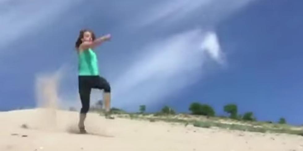 Watch This Reporter Fall Down a Sand Dune [VIDEO]