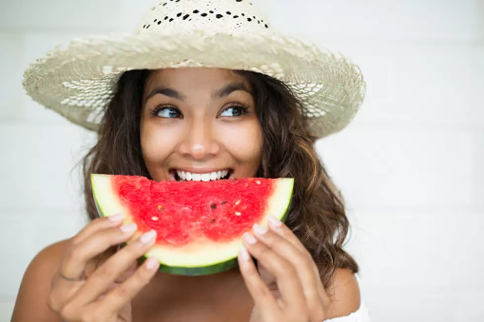 Closeup of Nice Woman Eating Slice of Watermelon