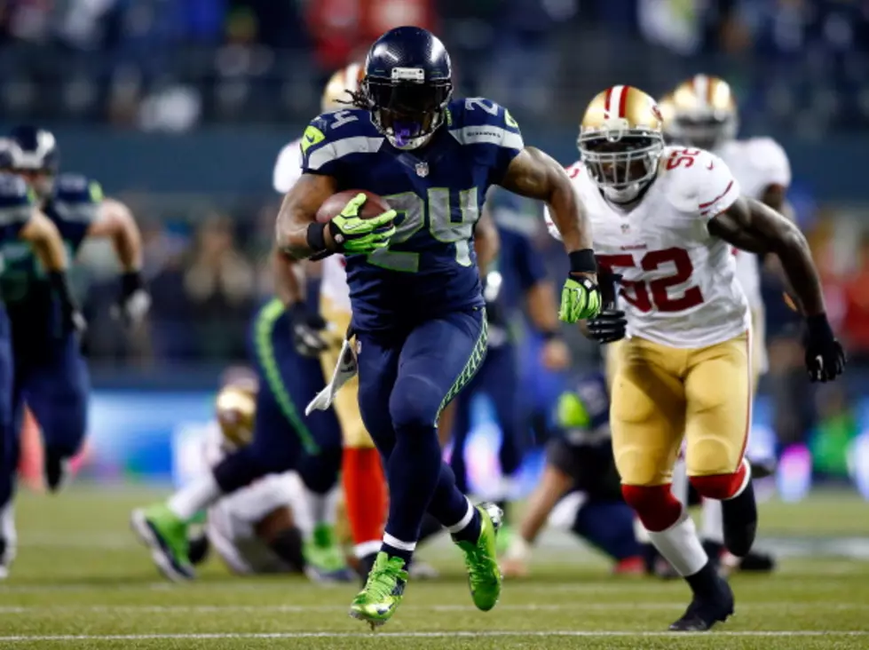 Marshawn Lynch Talks to Deion Sanders at Super Bowl XLVIII Media Day [VIDEO]