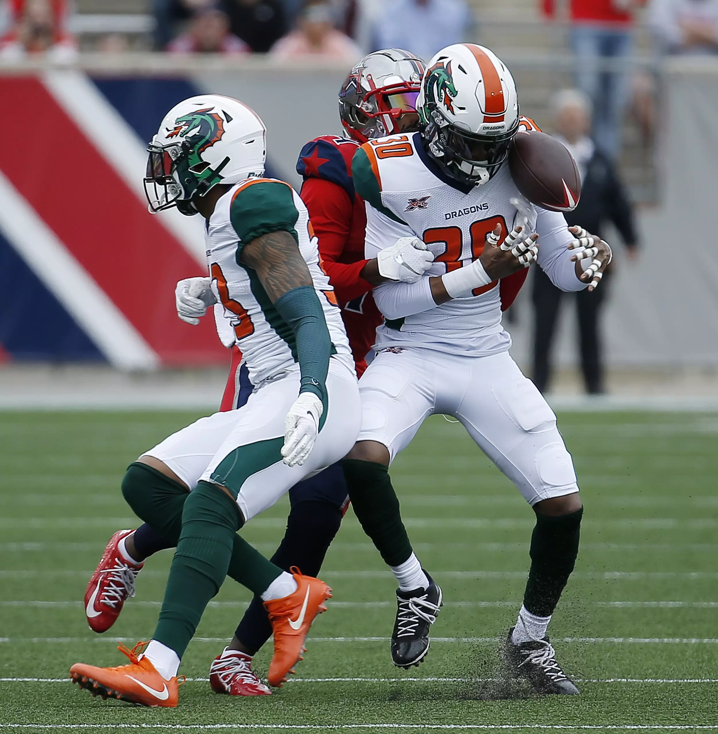 March 25, 2023: Seattle Sea Dragons wide receiver JUWAN GREEN (4) get  tackled during the Orlando Guardians vs Seattle Sea Dragons XFL game at  Camping World Stadium in Orlando, Fl on March