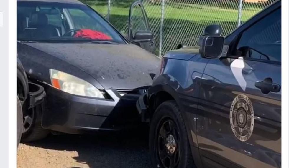 Drunk Driver Trapped in Fenced Lot Rams Cop Car Head On [VIDEO]