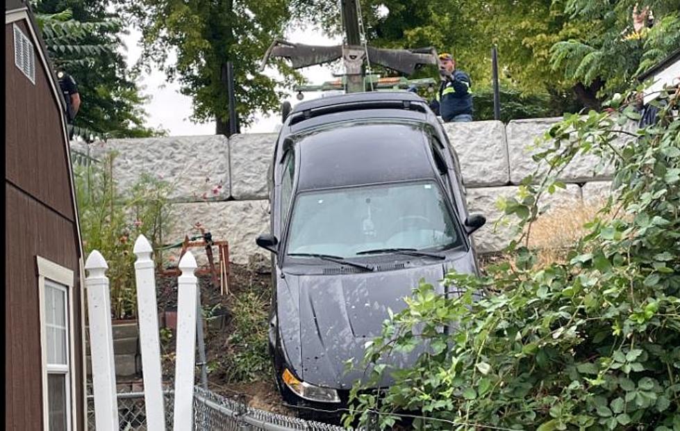 Car Plows Over Wall on Rain-Slicked Roads in College Place