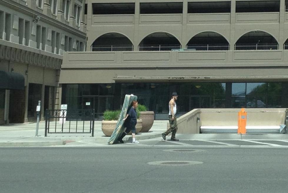 Girl In Cast Carries Mattress While Man Doesn’t Help In Downtown Yakima [PHOTO]