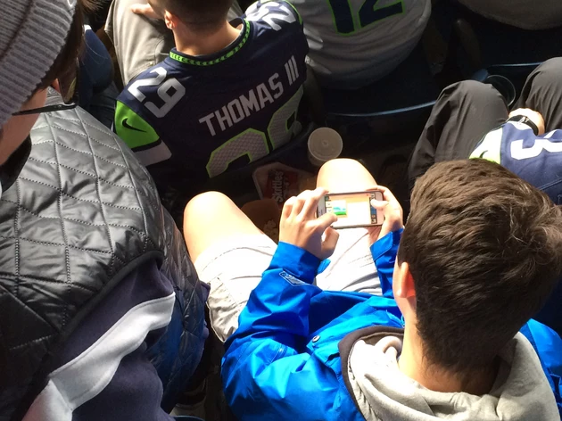Mom Spends Hundreds On Seahawks Tickets And This Kid Plays Video Games While There Is Action On The Field
