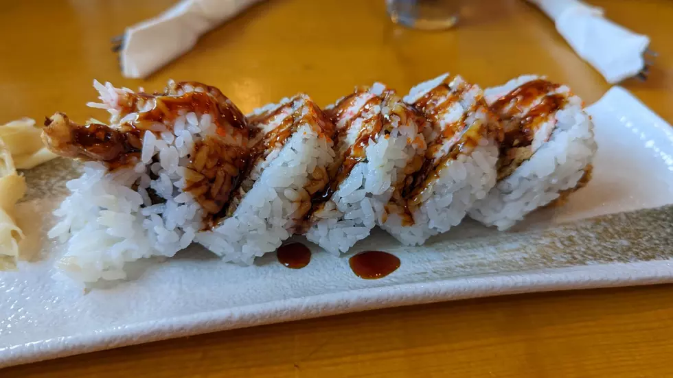 Premium Photo  Tasty sushi rolls guncan with a salmon
