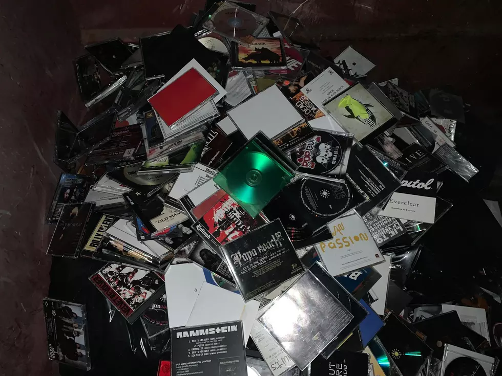 cds in a dumpster