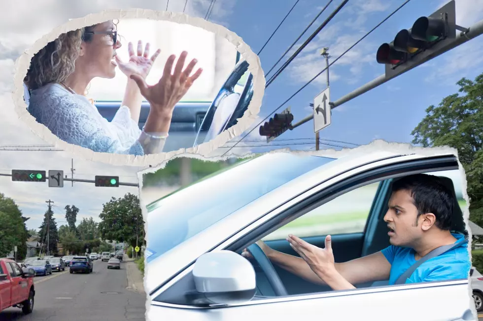 people in cars upset at traffic light