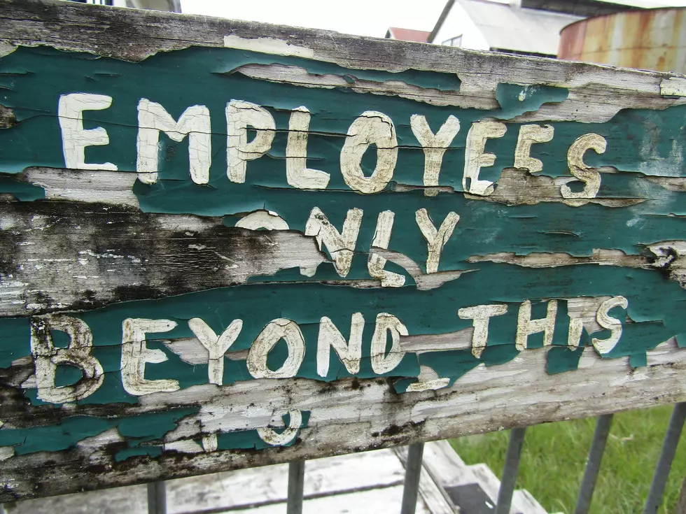 old sign that says employees only.