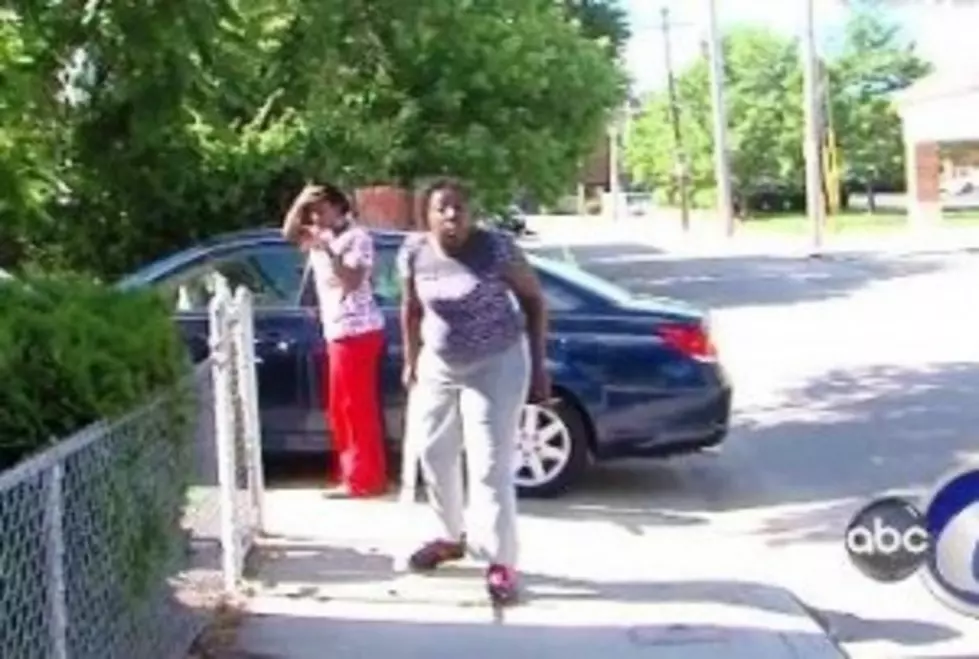 A Woman Being Interviewed by a News Crew Attacks Them By Throwing Rocks