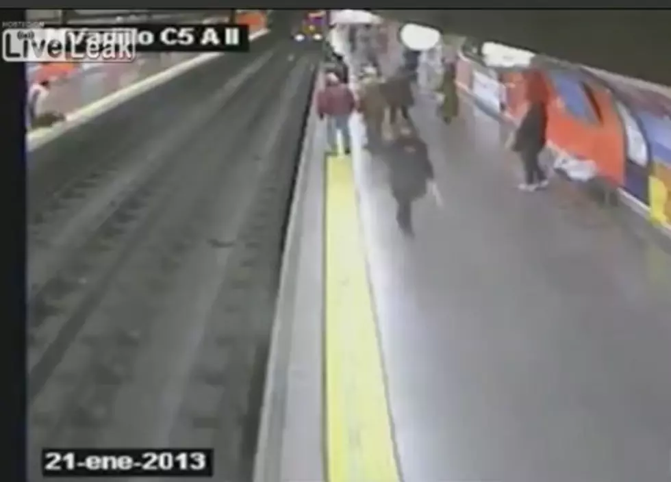 Woman Saved In the Nick of Time from Oncoming Train [VIDEO]