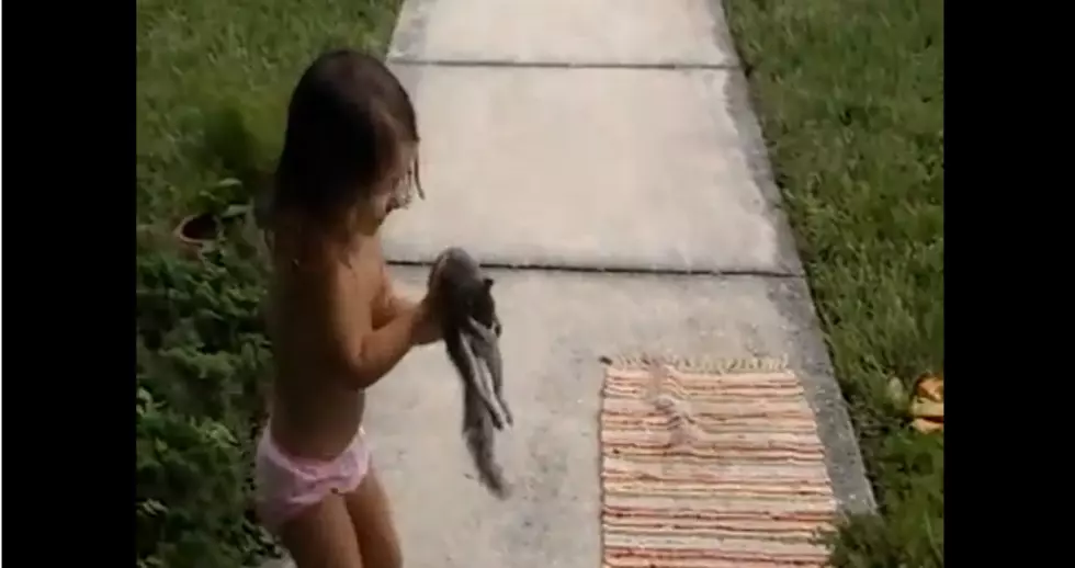 Parents Film Daughter Playing With Dead Squirrel [VIDEO]