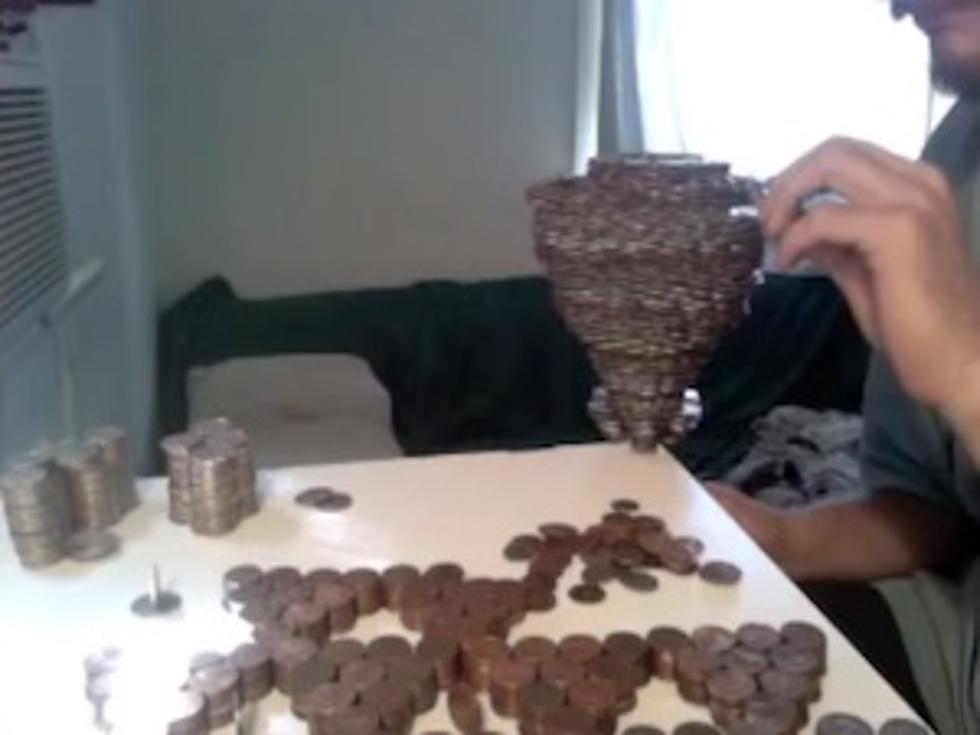 Guy Stacks 3,118 Coins on One Thin Dime [VIDEO]