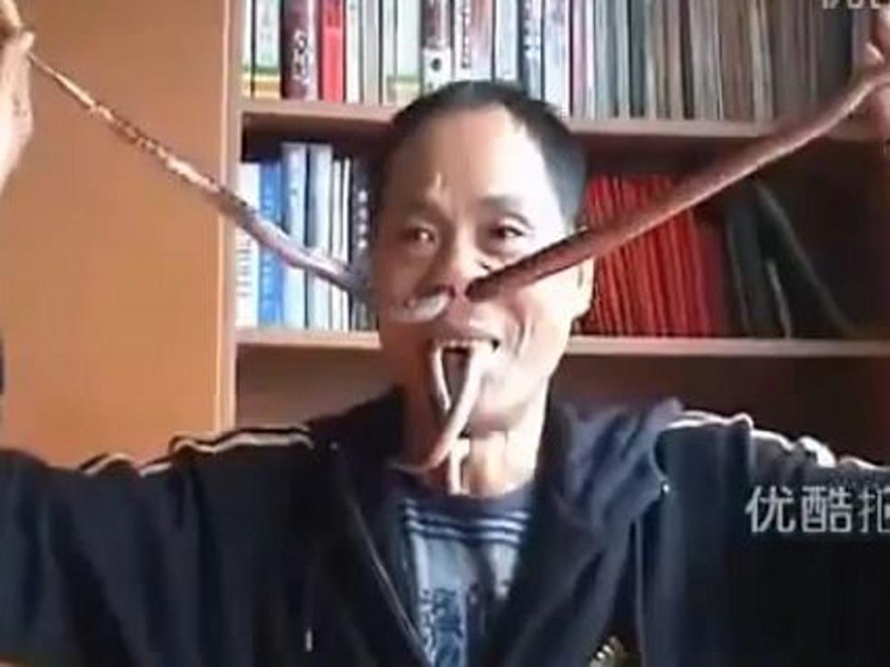 Man Shoves Snakes Up Nose and Releases Them Through Mouth [VIDEO]