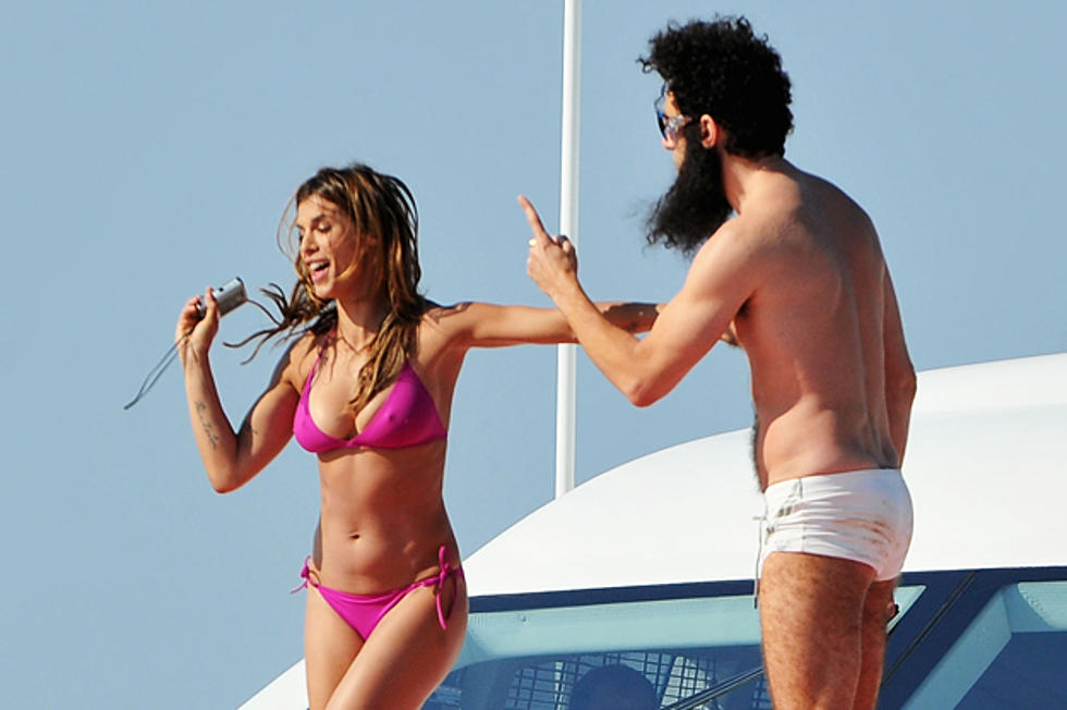 Elisabetta Canalis in a Bikini, Lubing Up ‘The Dictator’