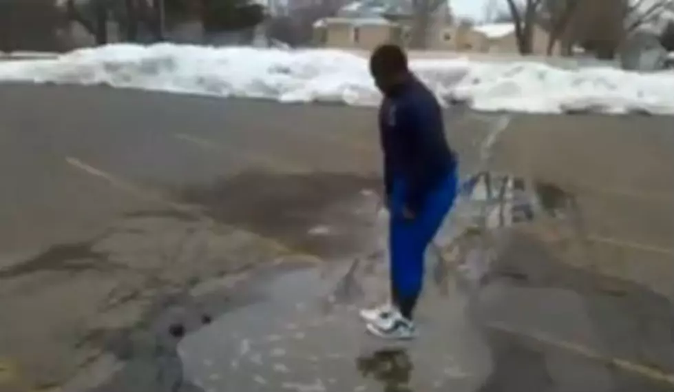 Watch Hilarious Video of Man Jumping into Puddle and Ending Up in a Massive Water Hole
