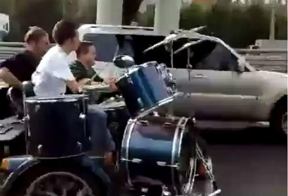 Band Plays While Riding a Motorcycle Down the Highway in Russia [VIDEO]