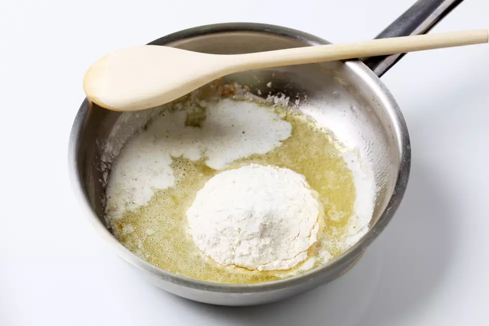 Wheat flour and heated butter in a saucepan