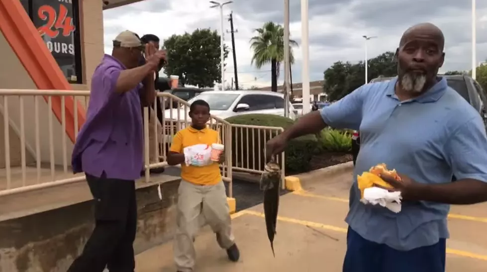 Man Catches Fish While Eating Whataburger During The Flood