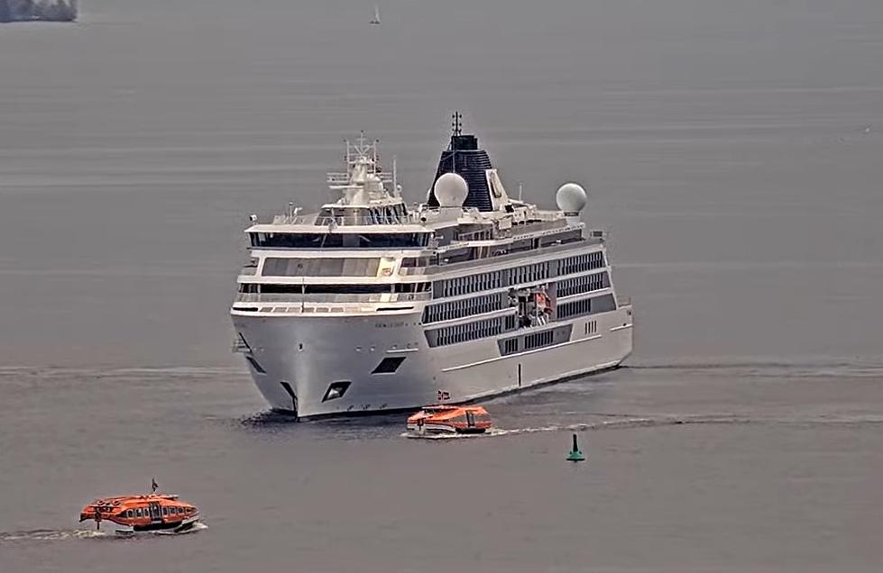What Are These Funny Small Orange Boats Around The Cruise Ship In Duluth?