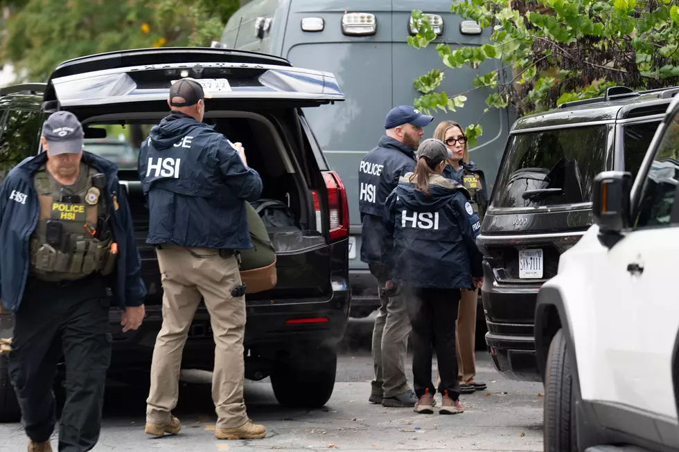 Homeland Security Investigators search the home of Rep. Ilhan Omar/Getty Images