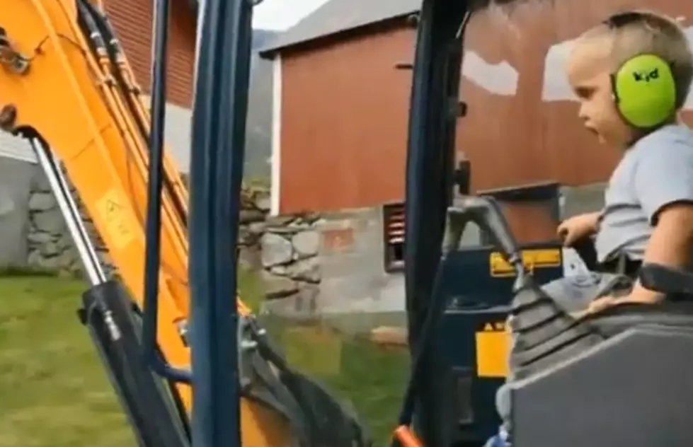 Little Boy Handles Big Machinery