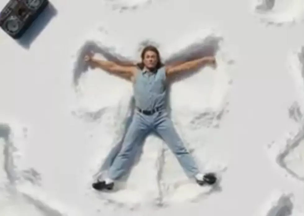 Jean-Claude Van Damme Making Snow Angels and Singing Love Songs for Beer [VIDEO]