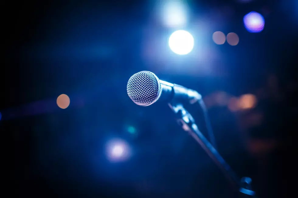 Microphone on stage against a background of auditorium