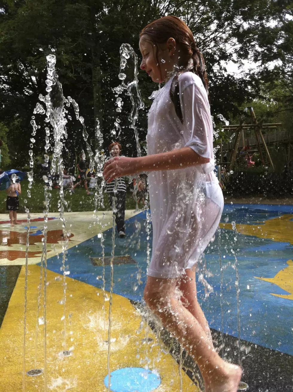 Young Girl Playing in a Fountain at a Splash Pad