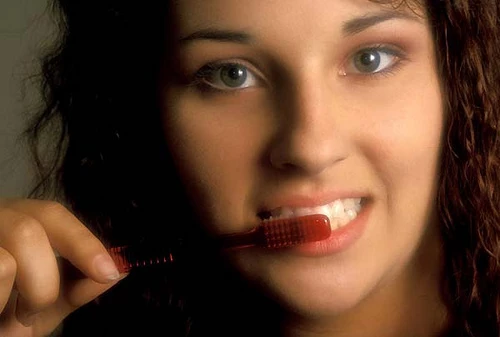 Woman Brushing Her Teeth