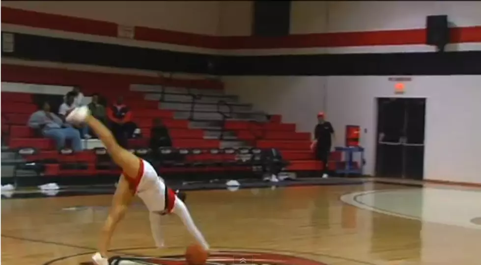 Cheerleader Makes Half Court Shot While Flipping [VIDEO]