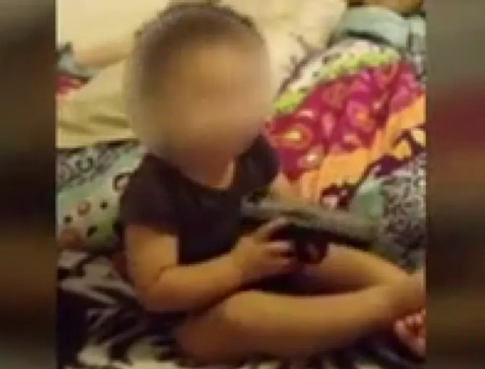 Parents Arrested for Letting One-Year-Old Play with Gun [VIDEO]