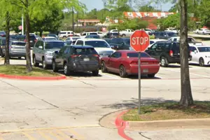 Texas Law and Rolling Through a Parking Lot Stop Sign