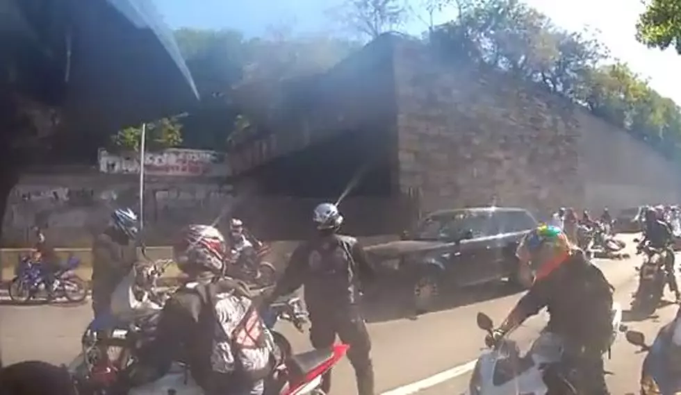SUV Driver Versus Motorcycle Pack Smash Up [VIDEO]