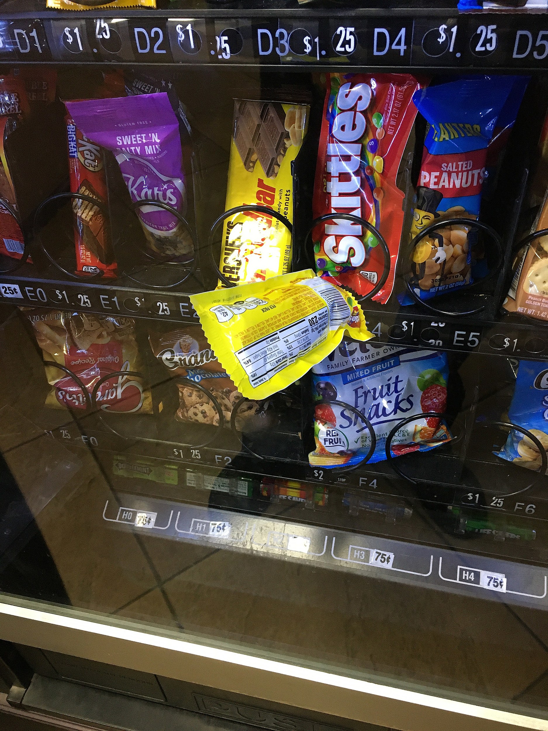 4 bags of pop corn stuck in the vending machine. You can only see