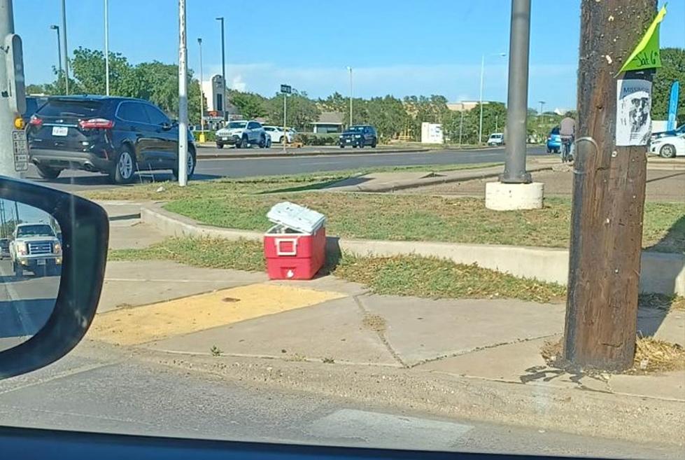 What’s Inside The Mysterious Red Cooler At 50th & Slide?