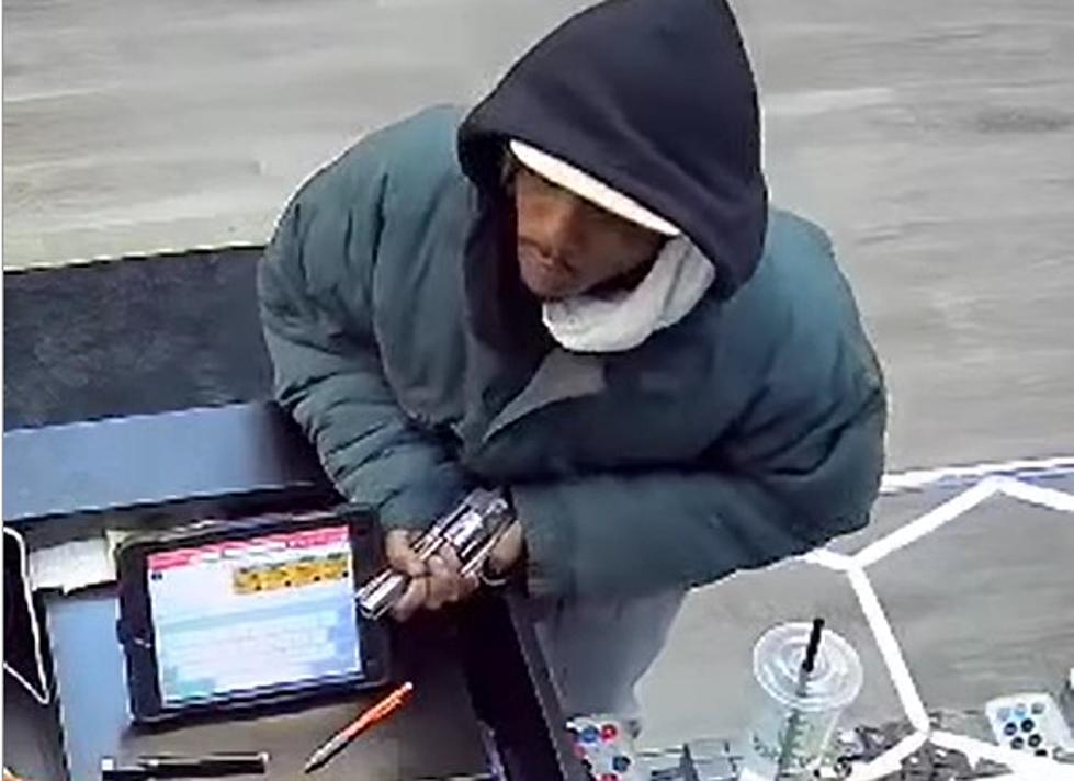 Terrifying Video of Man Robbing Store at Gunpoint